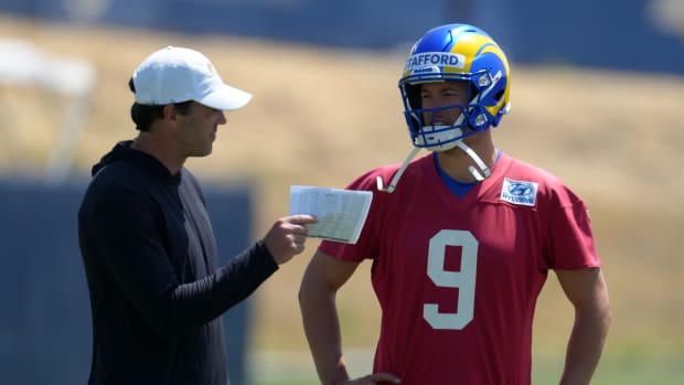 Jun 3, 2022; Thousand Oaks, CA, USA; Los Angeles Rams quarterback Matthew Stafford (9) and quarterbacks coach Zac Robinson during organized team activities at California Lutheran University.